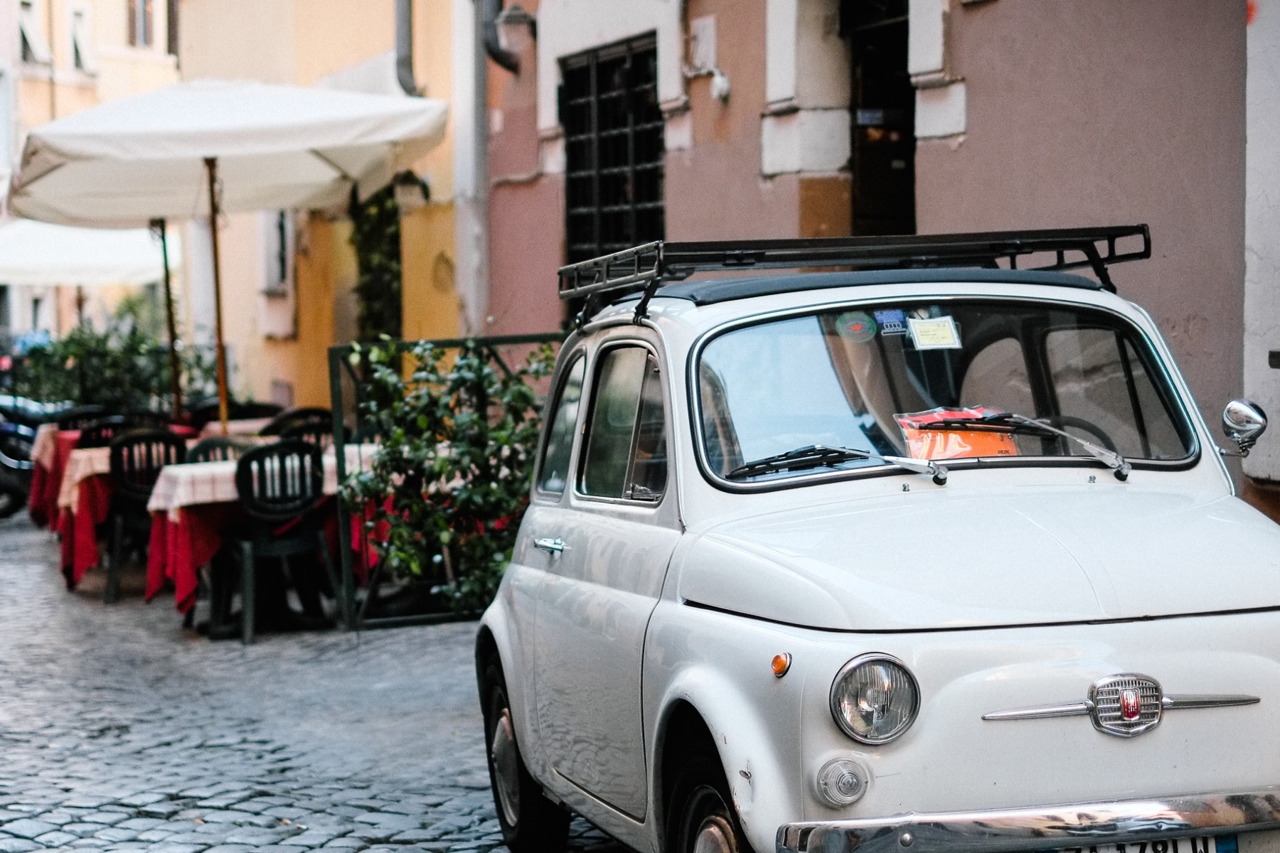 Typical town center in Tuscany with a Fiat 500