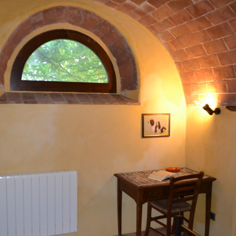 Window of the bedroom in an agriturismo in Tuscany